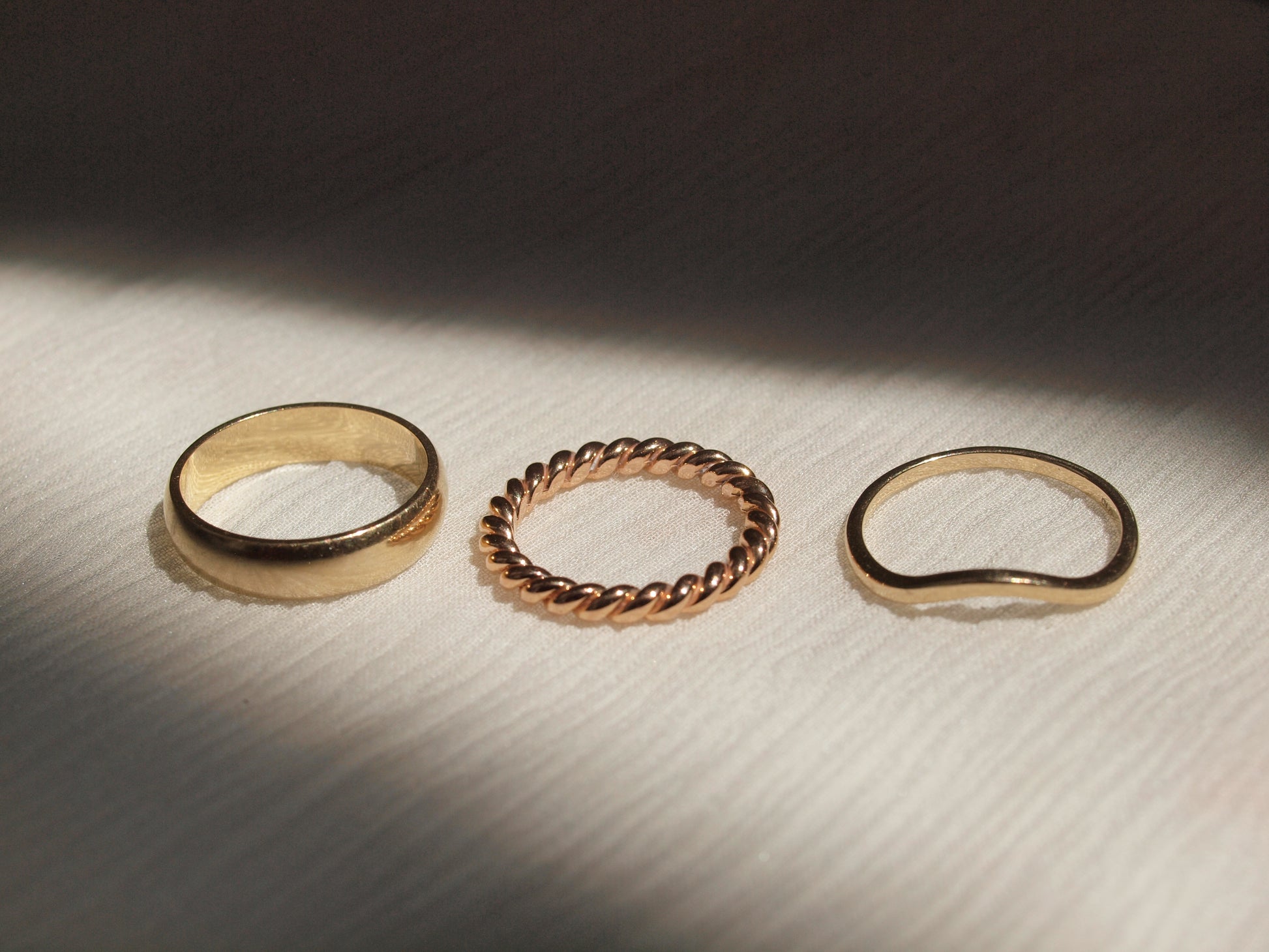 Vintage Gold Rings from left to right: 14k Yellow Gold Thick Band Size 6.25, 19k Rose Gold Twisted Ring Band Size 5, 14k Yellow Gold Waved Ring Size 6.75